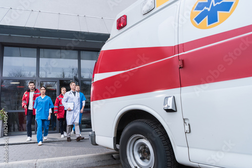 paramedic team going from hospital to ambulance