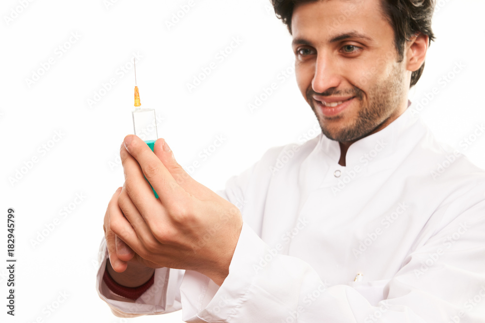 Doctor in medical uniform with syringe Doctor in medical uniform with syringe