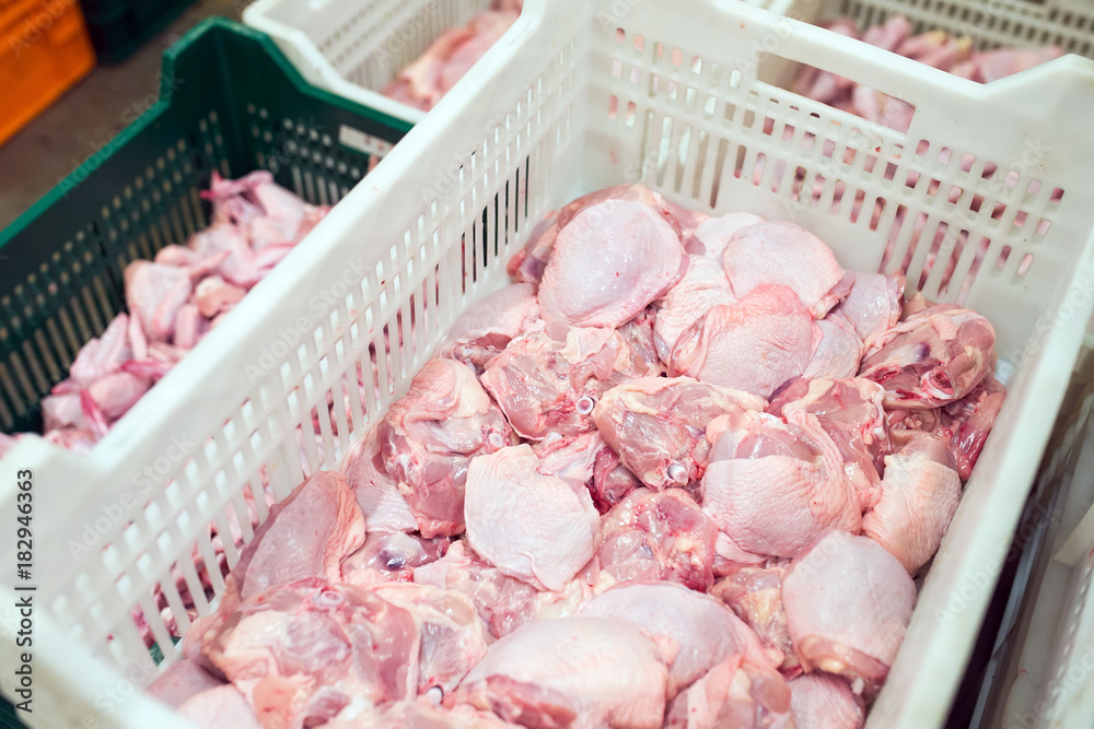 chicken meat in a meat processing plant. chicken meat in a meat processing plant.