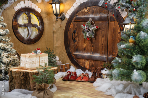 doors to the hobbit gnome house with Christmas decorations and shoes photo