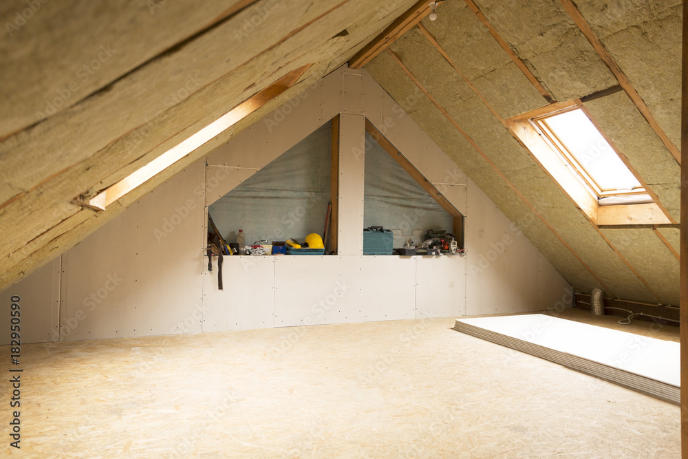 house attic under construction mansard wall insulation with rock wool - obrazy, fototapety, plakaty 