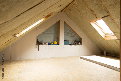 house attic under construction mansard wall insulation with rock wool photo