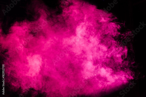 Magenta theatrical smoke on stage during a performance or show.