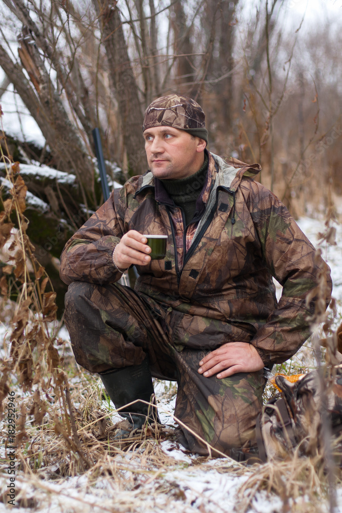 hunter resting during the winter hunt
