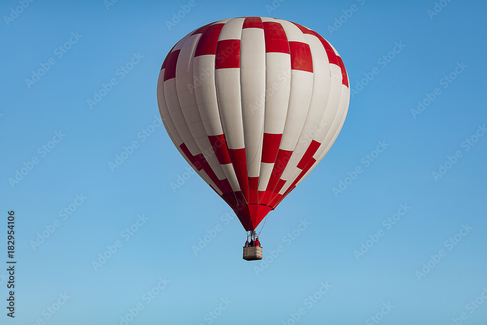 Obraz premium a huge, beautiful balloon in the cloudless blue sky closeup