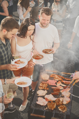 Sticker Group of people having meal at barbecue party