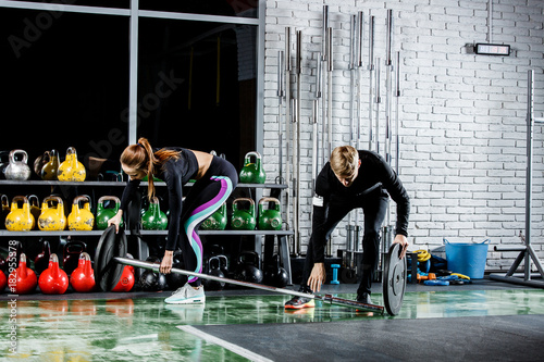 the girl is getting ready for the exercise with the trainer