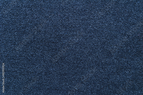 Background of dark blue cotton cloth with spools