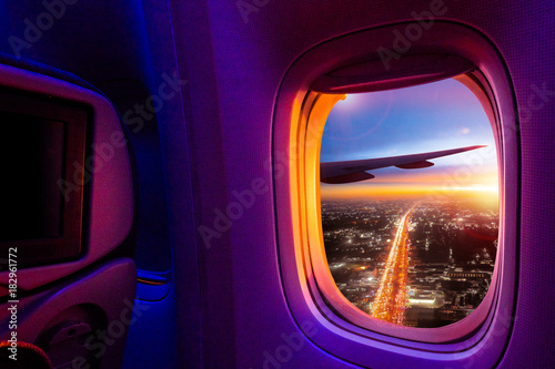 Beautiful scenic view of sunset through the aircraft window. Image save-path for window of airplane.
