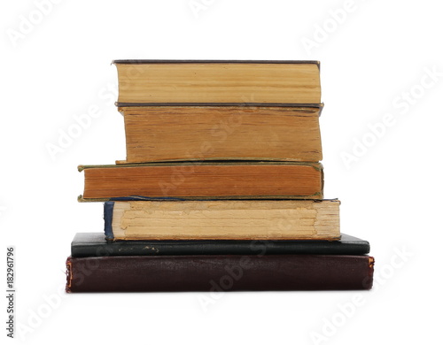 Stack of old antique big books isolated on white background