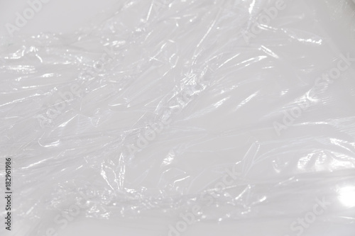 wrapping plastic transparent food film on white background.