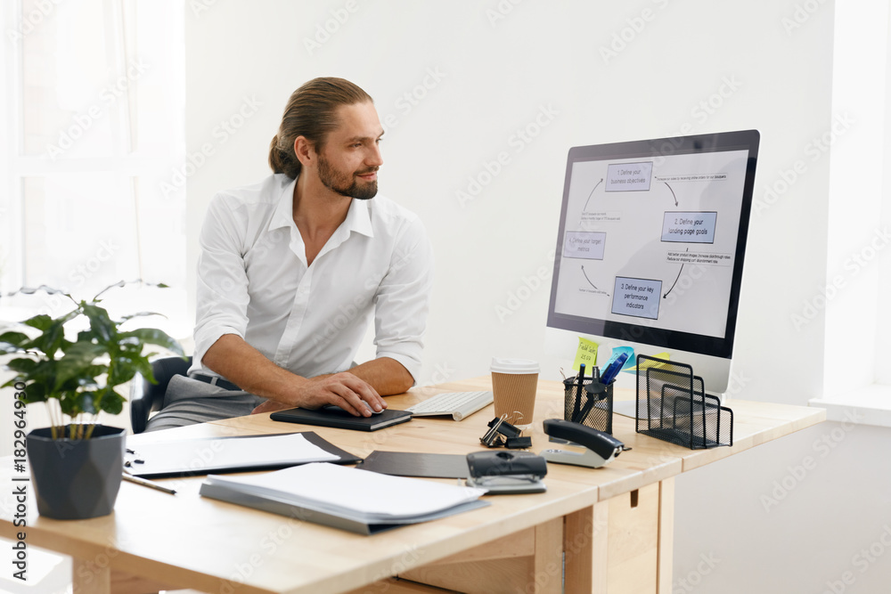 Fototapeta premium Young Business Man Working On Computer In Office.