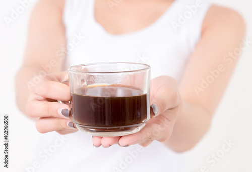 Beautiful young asia woman with a cup of coffee. Isolated on white background. Studio lighting. Concept for healthy.