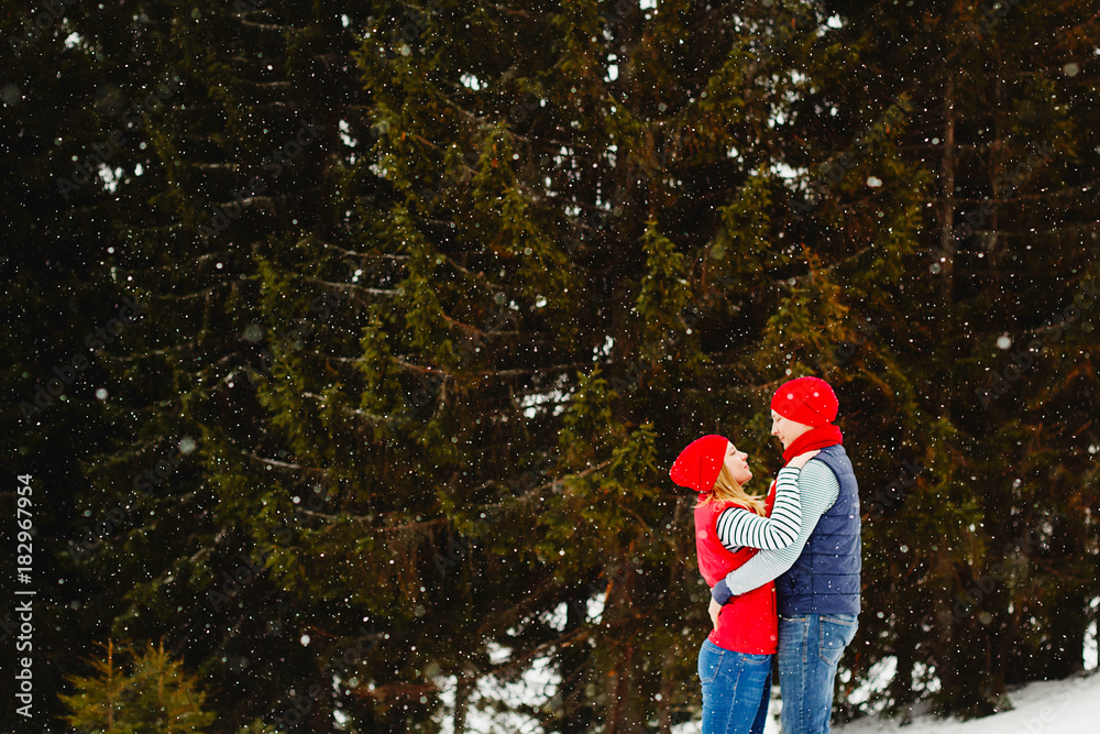 © Sunny - Young happy couple outdoors in winter park