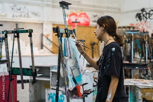 Creative woman painting in studio photo