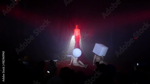 Half naked girls on stage. Contemporary art, on stage half-naked girls in masks, the concept of the modern vision of art