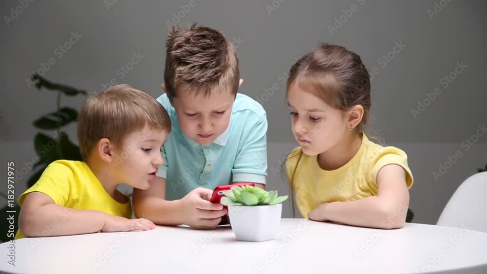 children play the game on smartphone children play the game on smartphone