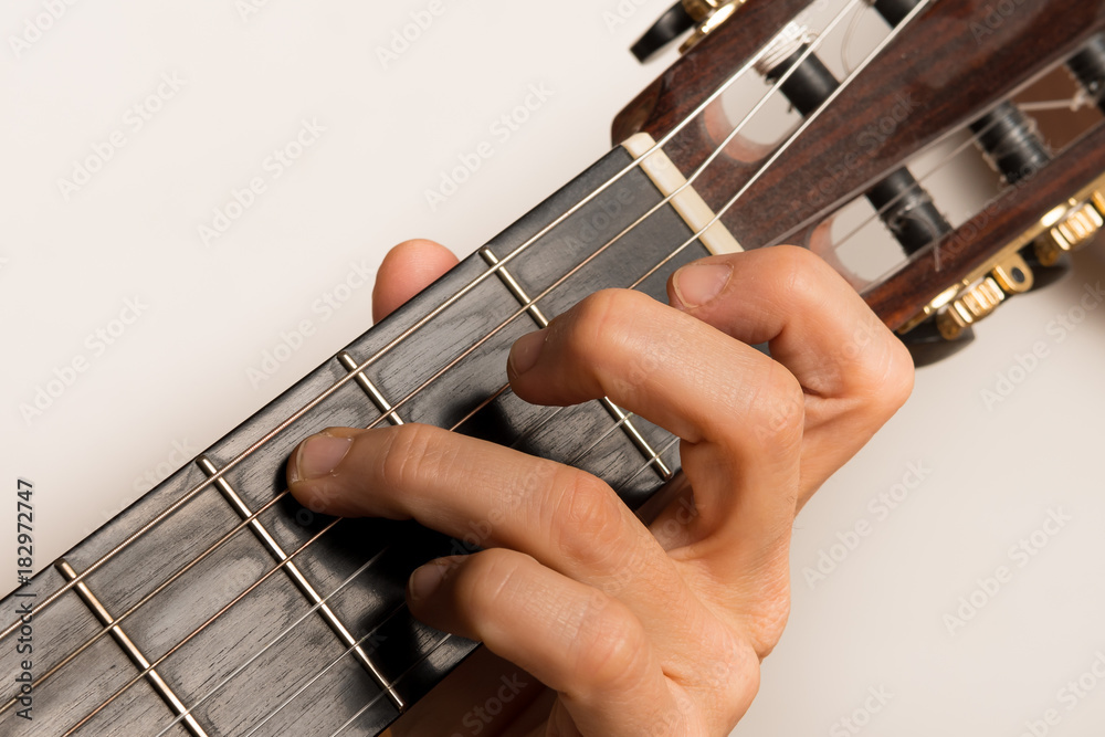 Closeup of someone playing the guitar, hand strings Closeup of someone playing the guitar, hand strings