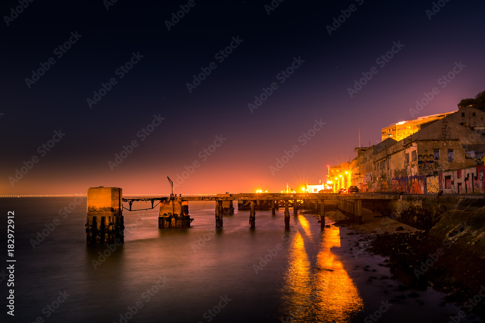 Sunset by the Pier in Caçilhas Portugal