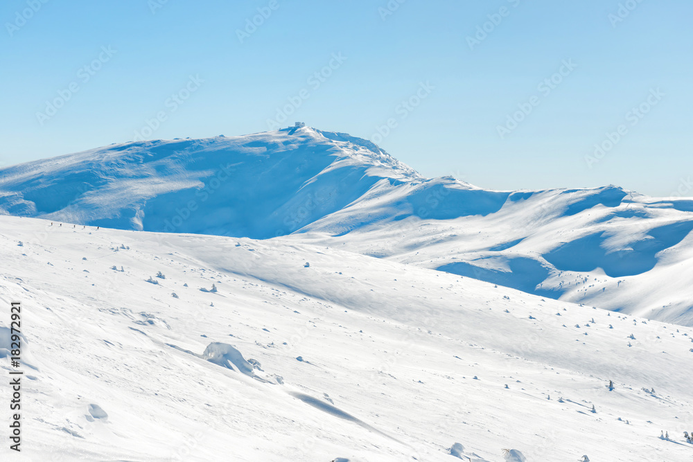 Range of mountains peaks in snow. Winter landscape