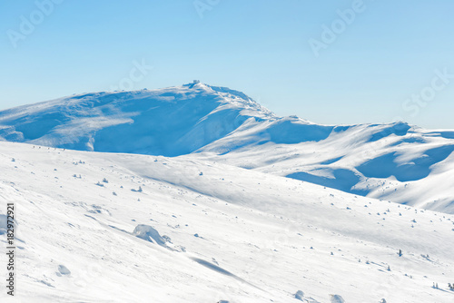 Fototapeta Naklejka Na Ścianę i Meble -  Range of mountains peaks in snow. Winter landscape