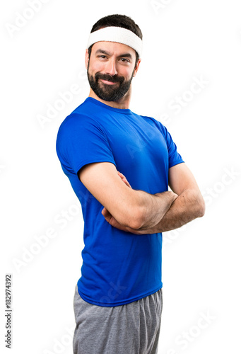Funny sportsman with his arms crossed on isolated white background