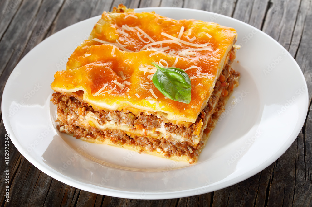 a portion of delicious italian lasagna a portion of delicious italian lasagna