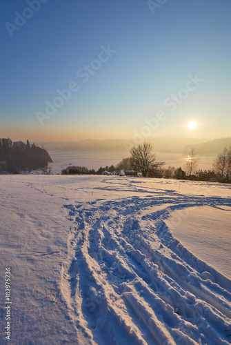 Snow covered trees in the mountains at sunset. Beautiful winter landscape. Winter forest.