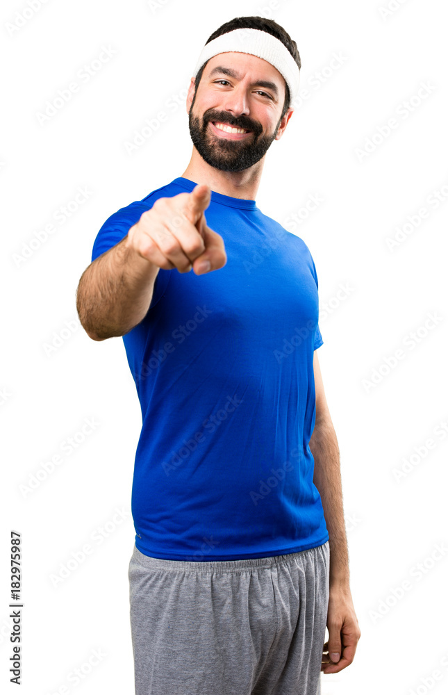 Funny sportsman pointing to the front on isolated white background Funny sportsman pointing to the front on isolated white background