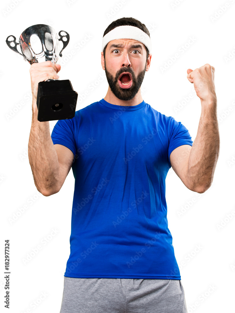 Funny sportsman holding a trophy on isolated white background Funny sportsman holding a trophy on isolated white background