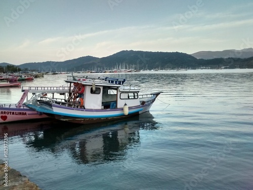 Boat on the calm sea of Paraty