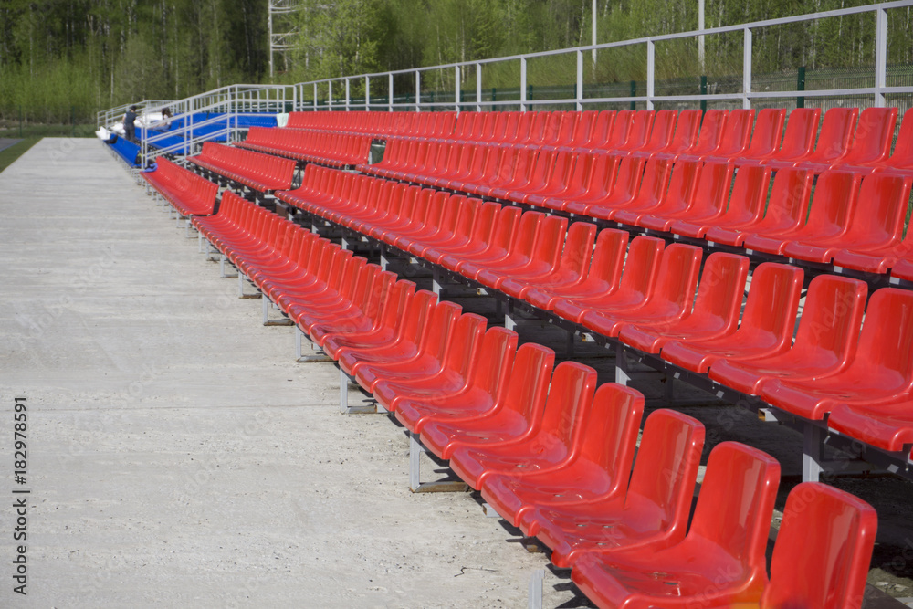 Fototapeta premium blue, red, white rows of seats on the stadium