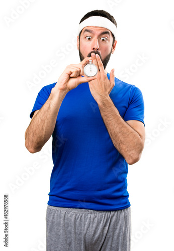 Surprised Funny sportsman holding vintage chronometer on isolated white background