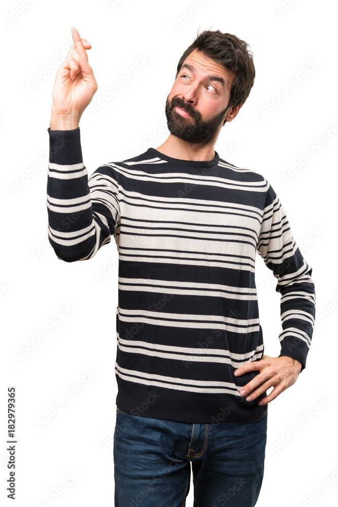 Man with beard with his fingers crossing Man with beard with his fingers crossing