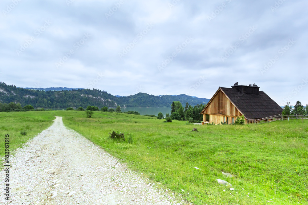 Beautiful scenery of Tatra mountains with wooden hut in Poland