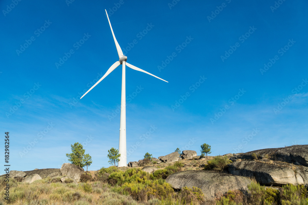Wind turbines in a rocky mountains in Portugal Wind turbines in a rocky mountains in Portugal