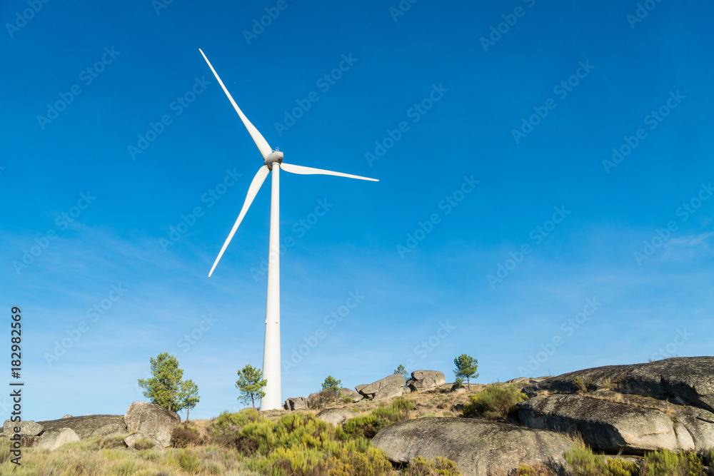 Wind turbines in a rocky mountains in Portugal Wind turbines in a rocky mountains in Portugal