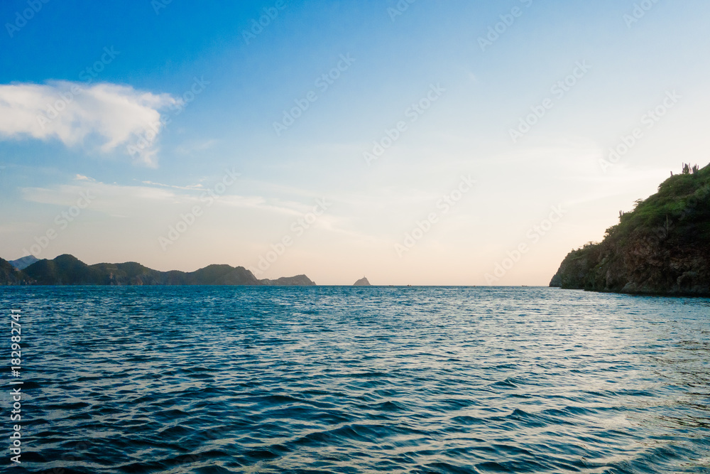 Obraz premium Beautiful outdoor view of caribean beach with huge mountain behind, Taganga, Colombia