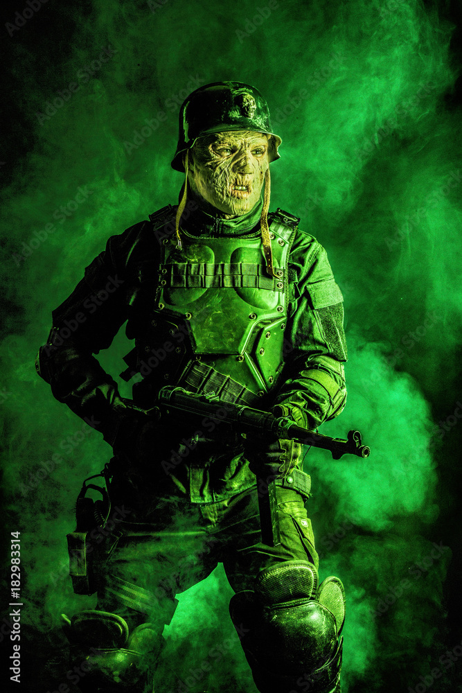 Ugly face of Futuristic nazi soldier in gas mask and steel helmet. Skin burned by atomic flame Ugly face of Futuristic nazi soldier in gas mask and steel helmet. Skin burned by atomic flame