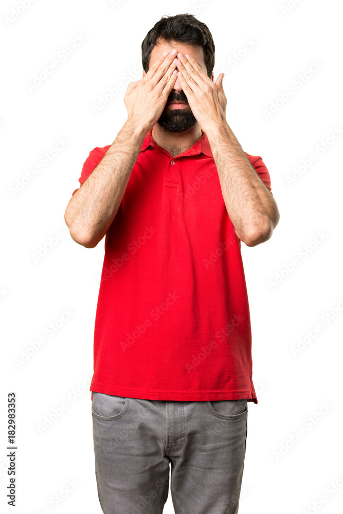 Handsome man covering his eyes Handsome man covering his eyes