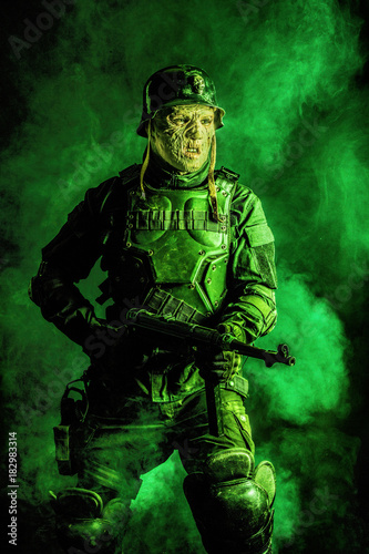 Ugly face of Futuristic nazi soldier in gas mask and steel helmet. Skin burned by atomic flame