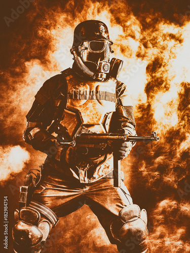 Futuristic nazi soldier in fire and smoke gas mask and steel helmet with schmeisser handgun photo