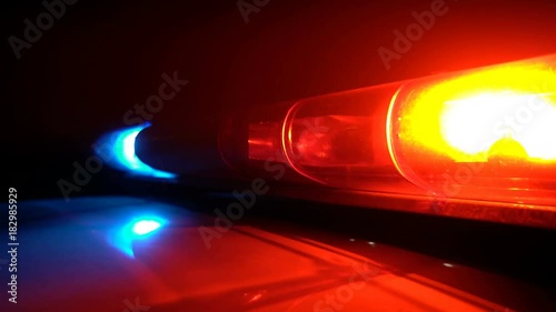 Police blue and red lamp flashing spinning in the dark