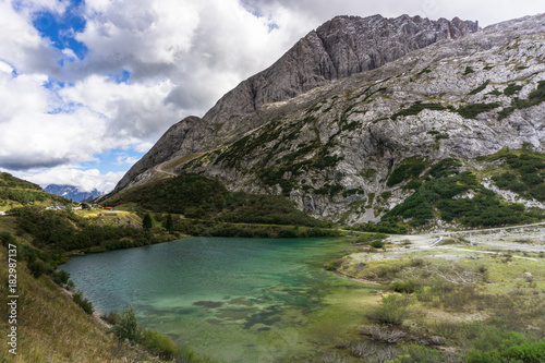 mountain lake near the Fedaia Pass in the Italian Dolomites