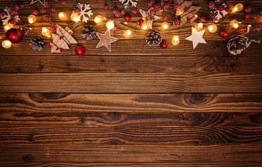 Christmas background with wooden decorations and spot lights.