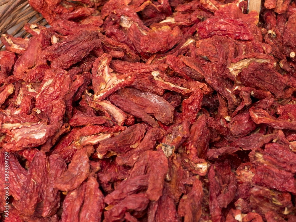closeup of pile of dried tomatoes closeup of pile of dried tomatoes