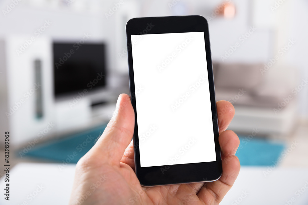 Person Holding Smartphone With Blank White Screen Person Holding Smartphone With Blank White Screen