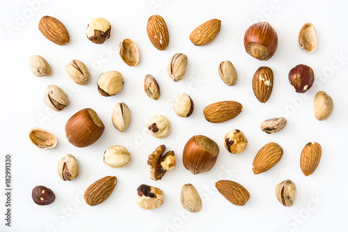 Assorted mixed nuts pattern isolated on white background. Top view

