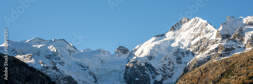 white snow-covered mountain peaks of the Bernina mountain range in the Morteratsch Valley near St. Moritz in the Swiss Alps