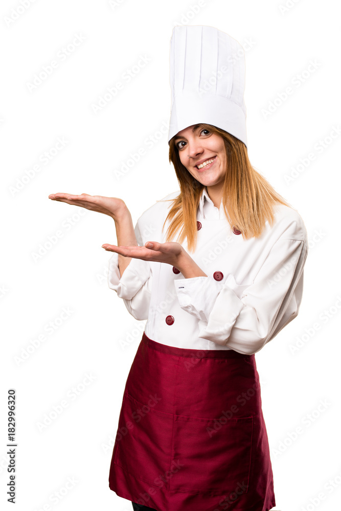 Beautiful chef woman presenting something Beautiful chef woman presenting something
